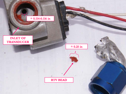 RTV bead in reference to the transducer inlet. (Photo: NTSB)