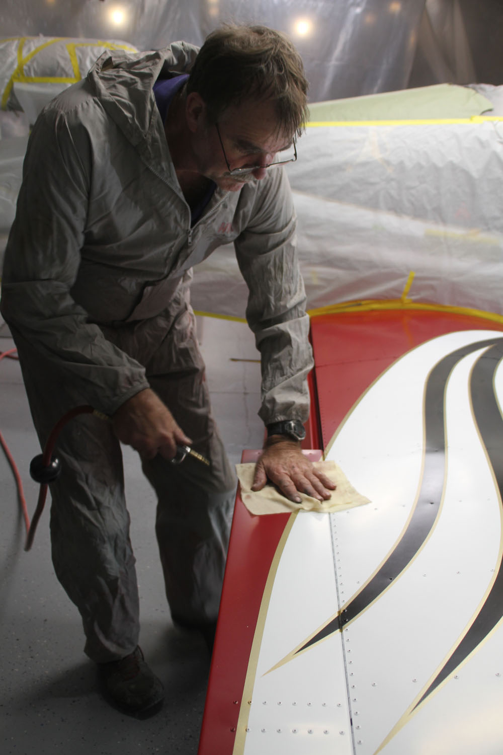 High pressure air and a dry cloth were used in the last step before applying clear coat.